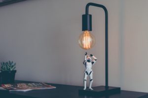 stormtrooper toy under a lightbulb